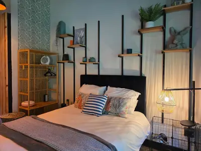 a bedroom with a bed with pillows on it at Stayfit 03 in Polokwane