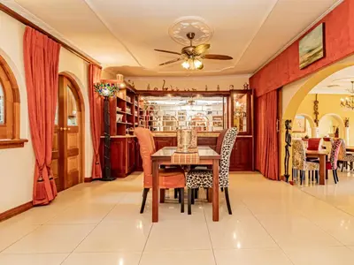 a dining room with a table and chairs at Casta Diva Boutique Hotel in Pretoria