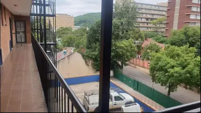 a view of a flooded street from a balcony at Neat, instaworthy, self-checkin flat in Pretoria in Pretoria
