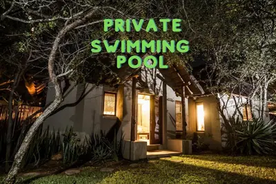 a house with a sign that reads private swimming pool at Hoedspruit Raptors Lodge N16 in Hoedspruit