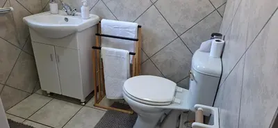 a small bathroom with a toilet and a sink at 9 on Deimos Ave in Polokwane