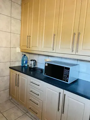 a microwave sitting on a counter in a kitchen at 9 on Deimos Ave in Polokwane