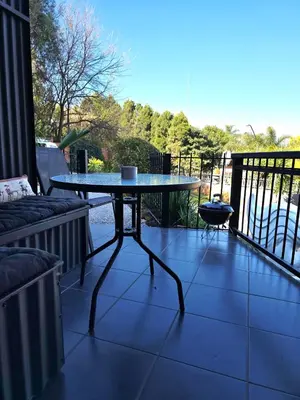 a table on top of a balcony with a view at The View in Pretoria