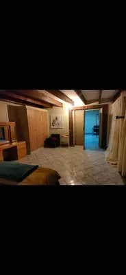 a large room with two beds and a room with a unintention at Tranquil, Home Away from Home in Pretoria
