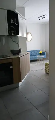 a living room with a couch and a table at Munyaka in Midrand