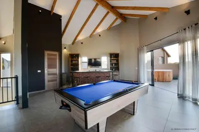 a large room with a pool table in it at Zebula Golf Estate & Spa Executive Holiday Homes in Mabula
