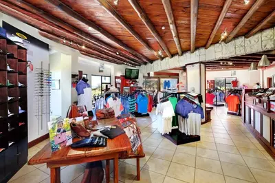a store with a lot of clothes on display at Zebula Golf Estate & Spa Executive Holiday Homes in Mabula