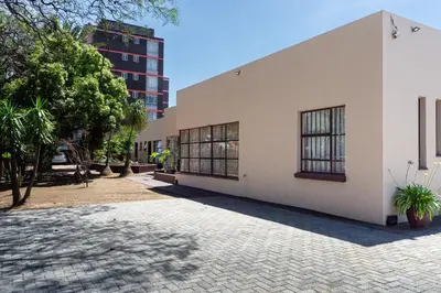 a building with windows on the side of it at 18 Churchill Avenue in Witbank