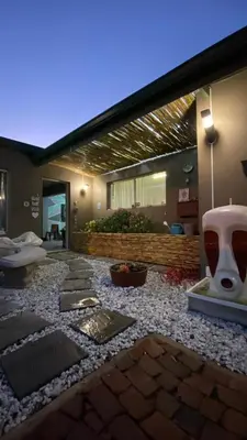 a building with a large room with a stone floor at Micnels B & B in Pretoria
