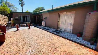 a brick driveway in front of a house at Micnels B & B in Pretoria