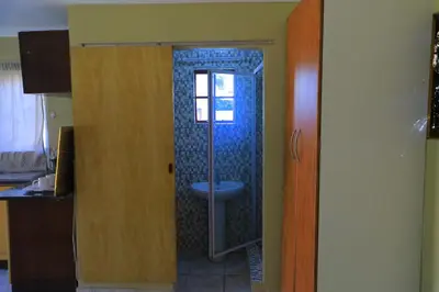 a bathroom with a shower with a toilet in it at Ivy at 6 Peace Sleep in Pretoria