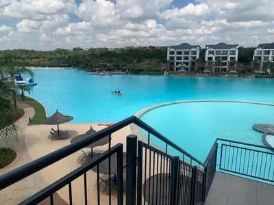 a view of a large swimming pool in a resort at The Blyde Siesta in Pretoria