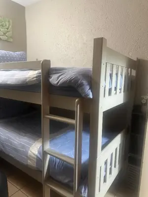 a couple of bunk beds in a room at Bytes - Waterberry Mbombela in Nelspruit
