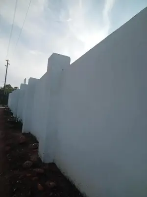a white fence on the side of a road at Zindi Zindiza Lodge in Sandrivier