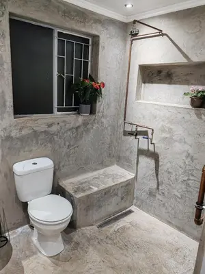 a bathroom with a toilet and a bath tub at Skuinslê in Centurion