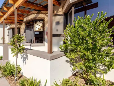 a house with a window on the side of it at Amalfi Place in Pretoria