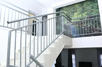 a staircase in a building with a painting on the wall at El-Gibbor Residence 1 in Ermelo