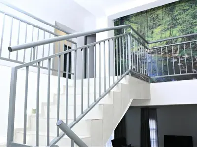 a staircase in a building with a painting on the wall at El-Gibbor Residence 1 in Ermelo