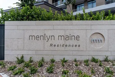 a sign for a manhattanamineresbestosbestosccess at Menlyn Maine Trilogy 1417 in Pretoria