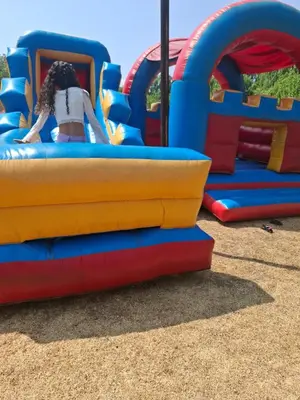 a girl is riding on a ride on a playground at Aaybee Recreational Home in Midrand