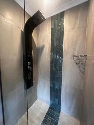 a shower with a glass door in a bathroom at Core accomodations in Pretoria