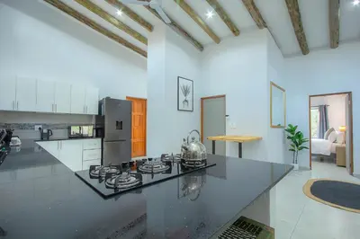 a large kitchen with a counter top in a room at The Bush House Kruger in Marloth Park