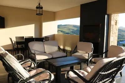 a waiting room with chairs and a flat screen tv at Highland Gate Golf & Trout Estate, House 910 in Dullstroom