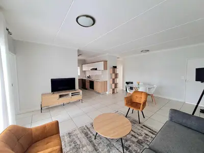 a living room with a couch and a table at The Blyde Crystal Lagoon in Pretoria