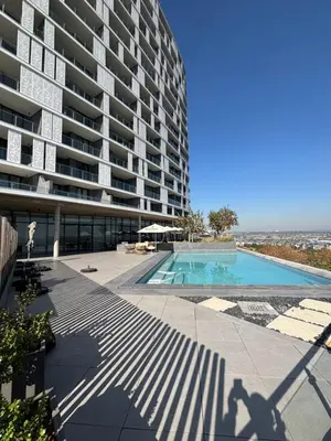 a large apartment building with a swimming pool at 2411 Ellipse Waterfall in Midrand