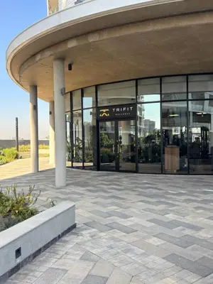 a large building with a circular roof with glass windows at 2411 Ellipse Waterfall in Midrand