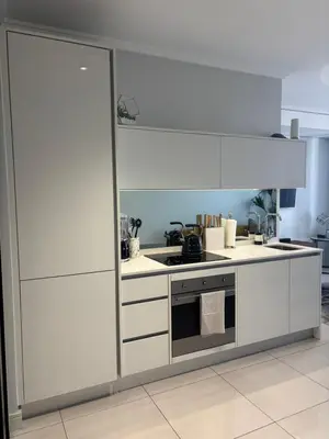 a kitchen with white cabinets and a stove at 2411 Ellipse Waterfall in Midrand