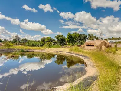 a body of water with clouds in the sky at Jacobs Well Guest House in Centurion