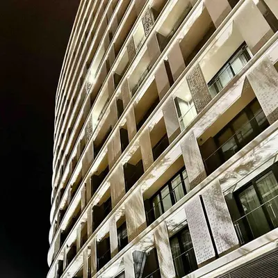 a tall building with a lot of windows at Explore Ellipse - Peacock Room in Midrand