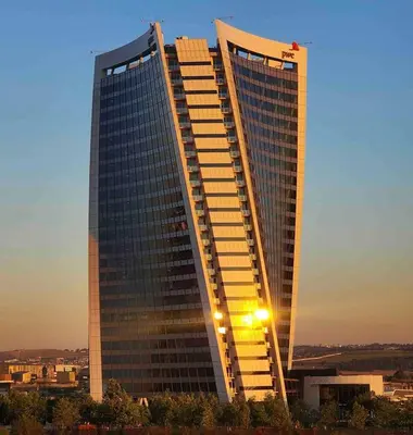 a tall building with a street light in front of it at Explore Ellipse - Peacock Room in Midrand