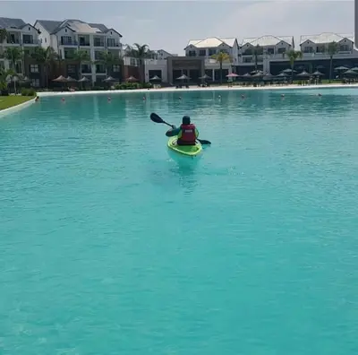 a person in a kayak in a large body of water at Serenity Stay at The Blyde River Walk Estate in Pretoria
