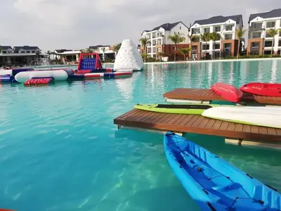 a swimming pool with several boats in the water at Serenity Stay at The Blyde River Walk Estate in Pretoria