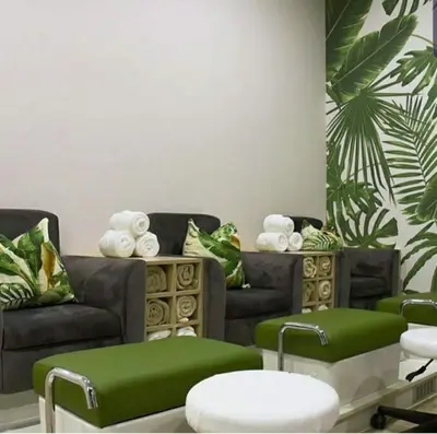 a living room with two couches and green ottoman at Serenity Stay at The Blyde River Walk Estate in Pretoria