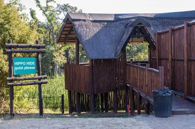 a small playground with a sign on a fence at Kruger Park Lodge Unit No 303 in Hazyview