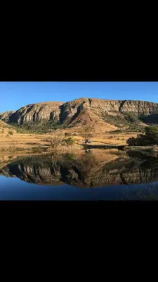 a reflection of a mountain in a body of water at Verlorenkloof Estate in Wagenbietjieshoek