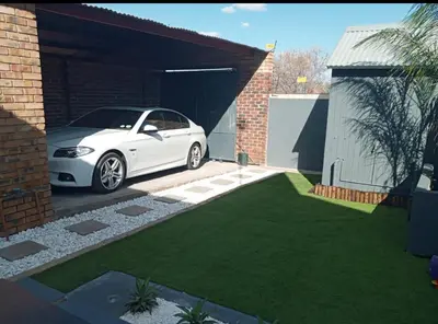 a white car is parked in a garage at 13 Orion Aparment in Polokwane