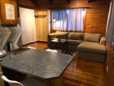 a living room with a couch and a table at Zur Alten Mine in Graskop