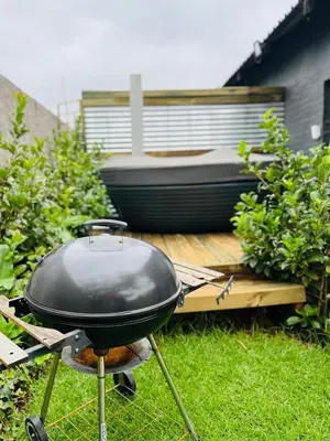 a grill sitting on a table in a yard at Clarkys Bucketlist Dullstroom in Dullstroom