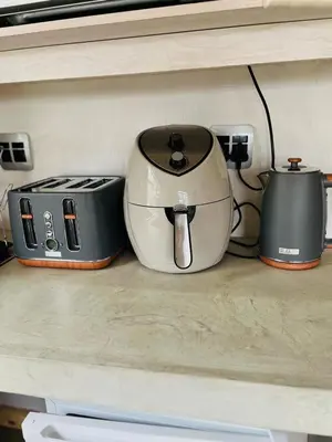 two toasters and a toaster sitting on a counter at Clarkys Bucketlist Dullstroom in Dullstroom