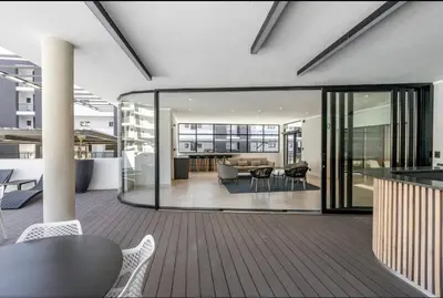 an open living room with a table and chairs at Next to Brooklyn Mall Cosy stay in Pretoria