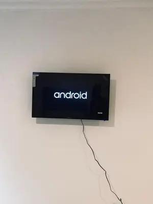 a tv on a wall with an amazon sign on it at Uncle Charles Guesthouse in Pretoria