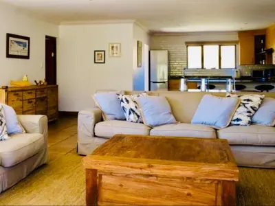 a living room with two couches and a coffee table at Riverbend on Komati in Machadodorp