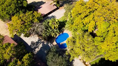 an overhead view of a blue car parked in a yard at Phabema Guest House in Steelpoort