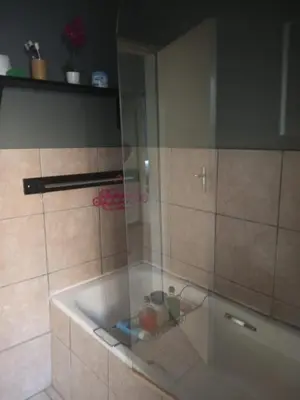 a shower with a glass door in a bathroom at Simply Stay in Polokwane