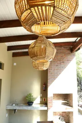 two wicker baskets are hanging from a ceiling at Warthog's Retreat in Marloth Park