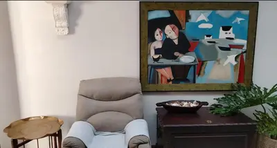 a room with a chair and a painting on the wall at Faerie Glen B&B in Pretoria